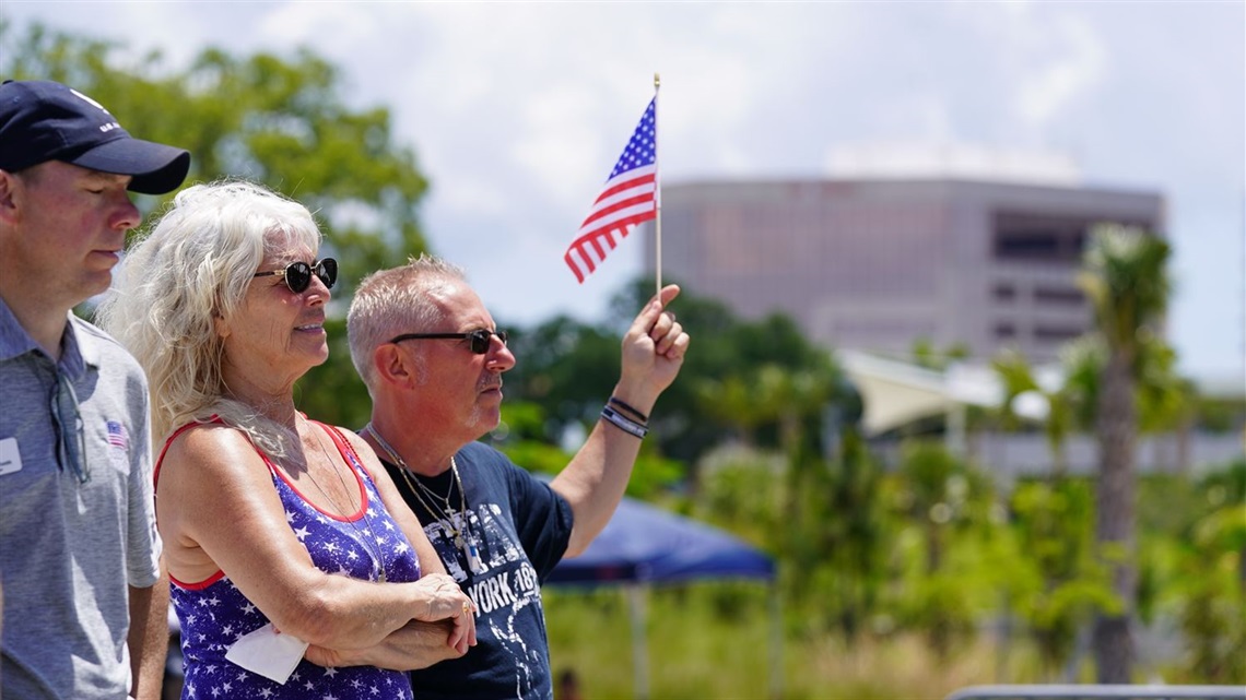 Person holding a flag