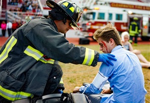 Clearwater-firemedic-giving-care.jpg