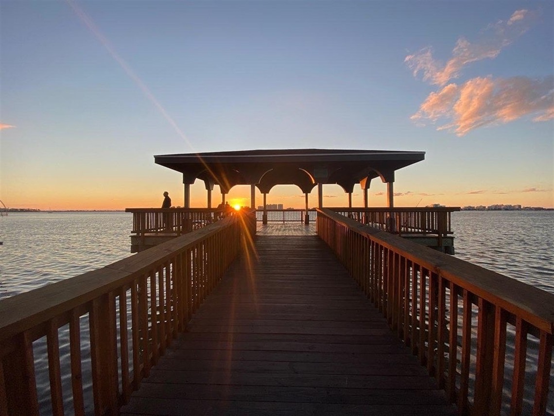 a dock with the sunset