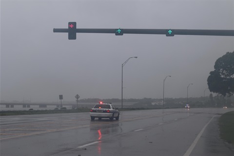 Police car in the middle of the storm