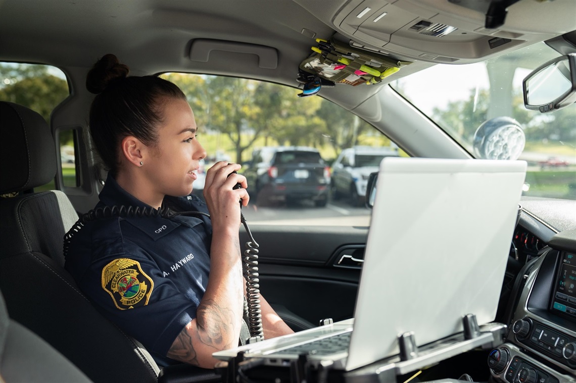 Police officer talking into a radio